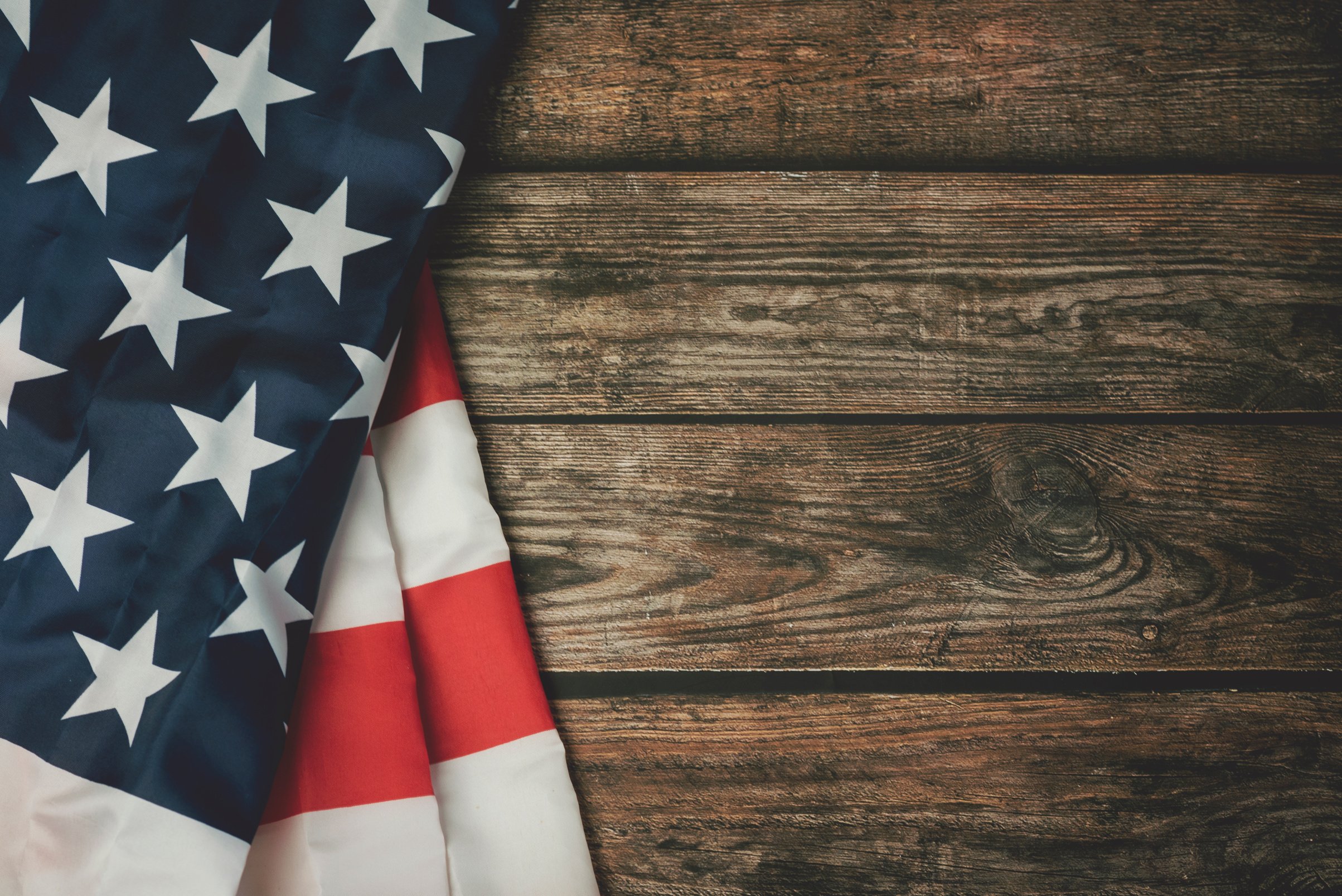 American Flag on Wooden Background